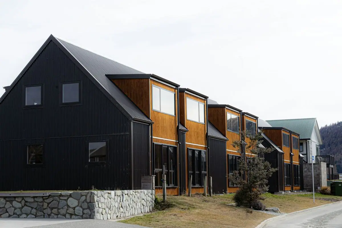 Row of modern townhomes with mountains behind